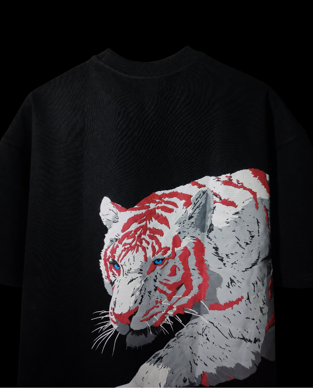 Black t-shirt with a graphic of a tiger's face in red and white on a dark background