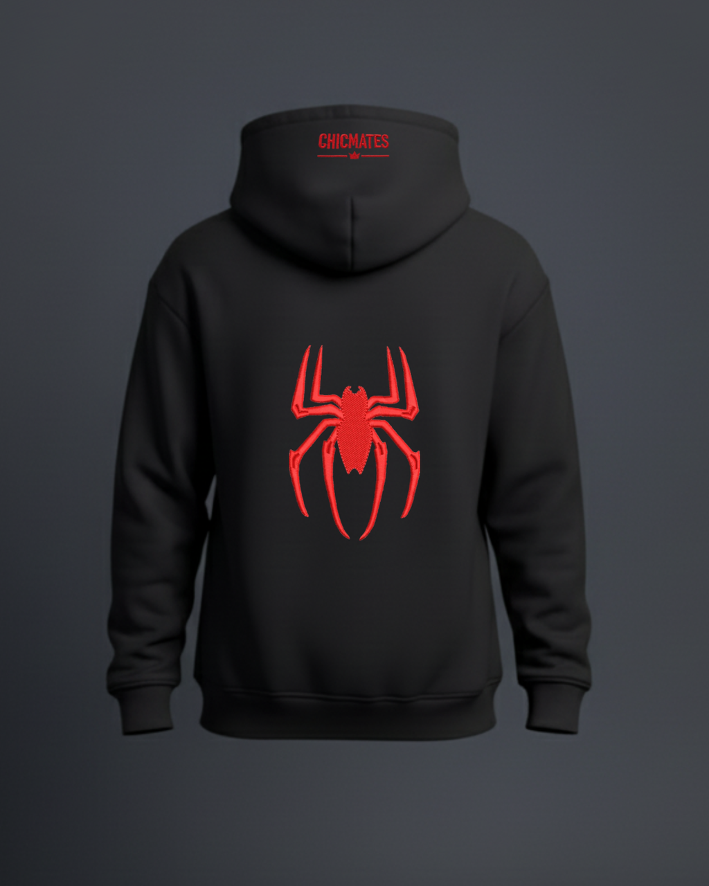 Black hoodie with red spider embroidery on the back against a dark background