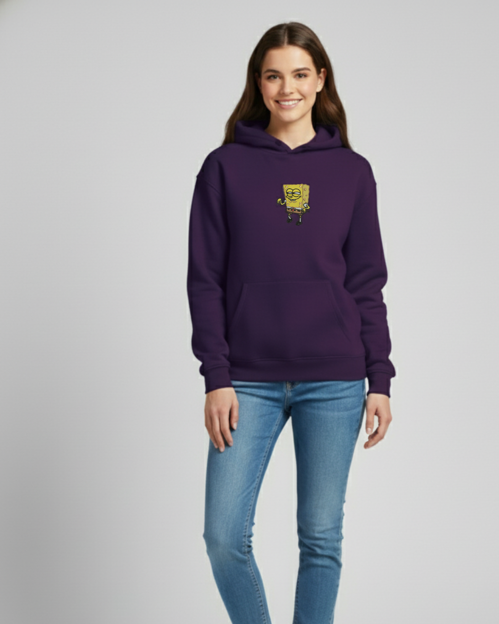 Person wearing a purple hoodie with a logo on a gray background